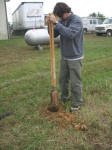 Equine Kingdom - Matt digging a post hole the hard way